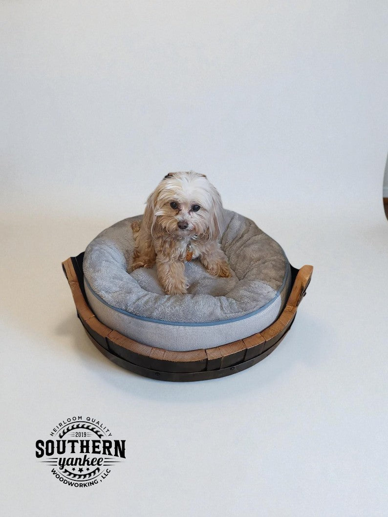 Small breed Barrel pet bed with little white dog