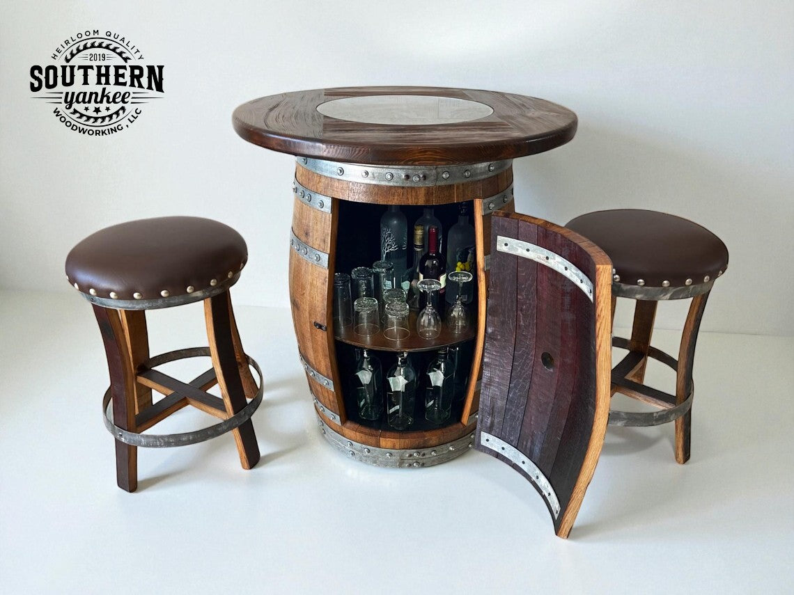 Barrel-shaped table with open cabinet displaying bottles and glasses, accompanied by two stools. Brand 'Southern Yankee Woodworking' visible.