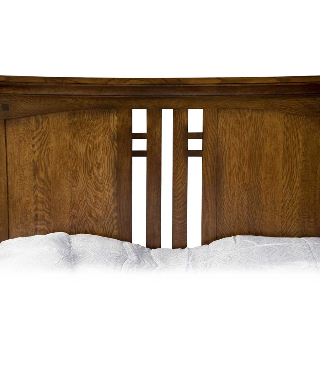 Wooden headboard with white bedding on a white background