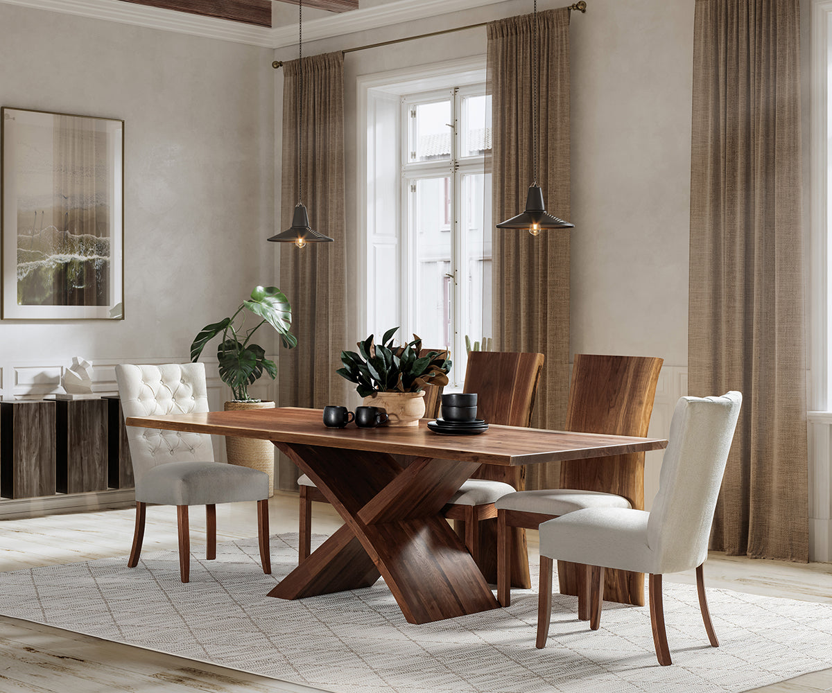 Dining room with wooden table and chairs in a well-lit room.