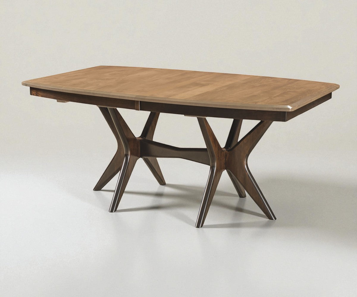 Wooden dining table with unique star-shaped legs on a plain background