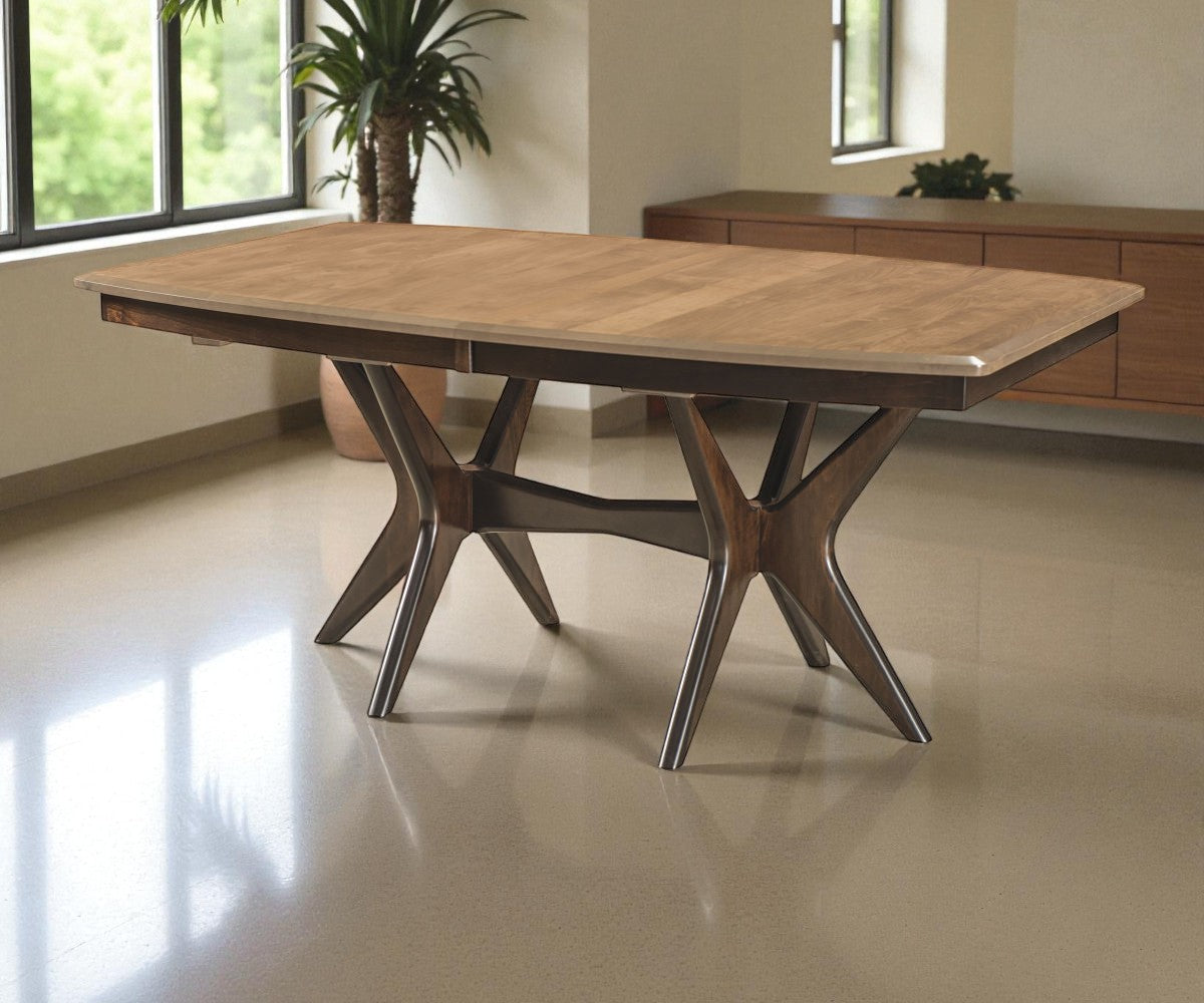 Wooden dining table with unique star-shaped legs in a modern room.