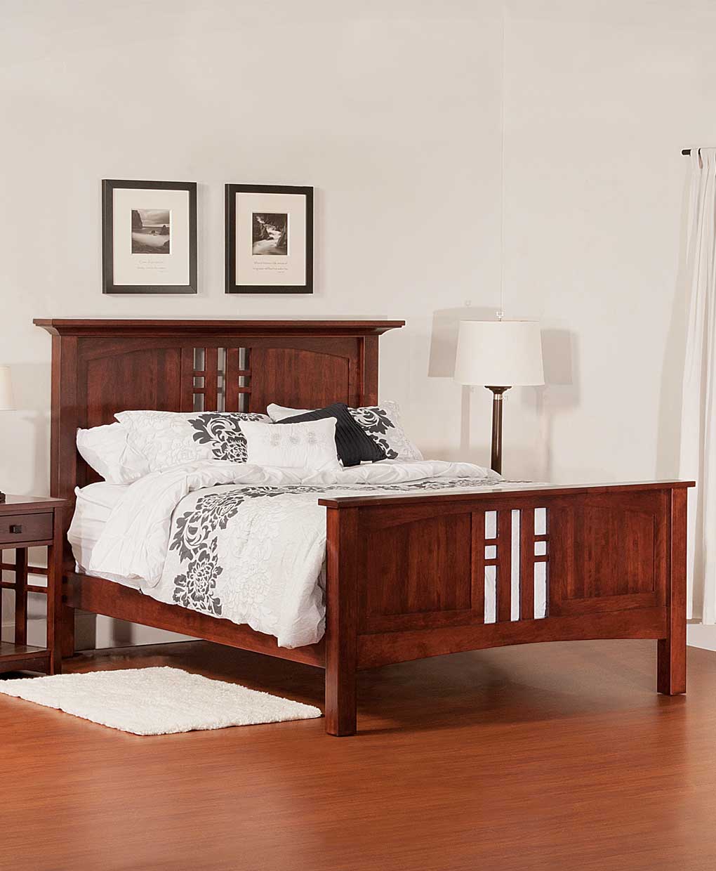 Wooden bed with white bedding in a bedroom setting