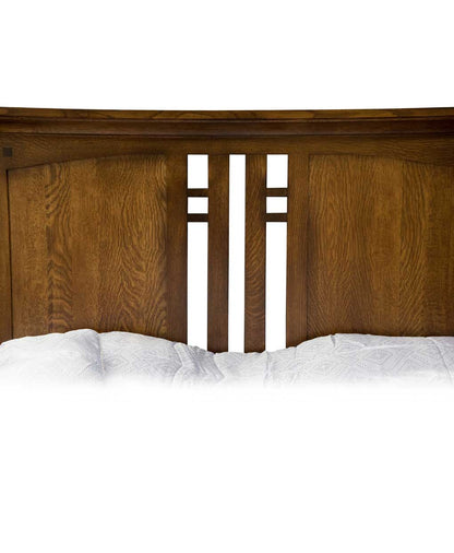 Wooden headboard with white bedding on a white background