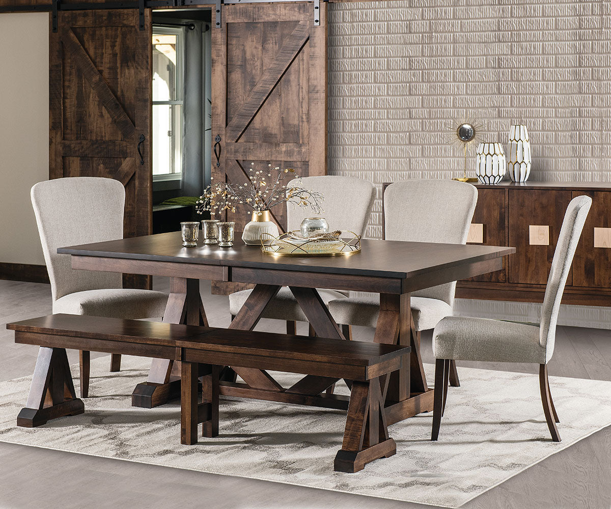 Dining room with wooden table, chairs, and bench in a home setting.