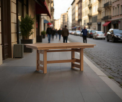 Wooden table on a sidewalk with a blurred street scene in the background